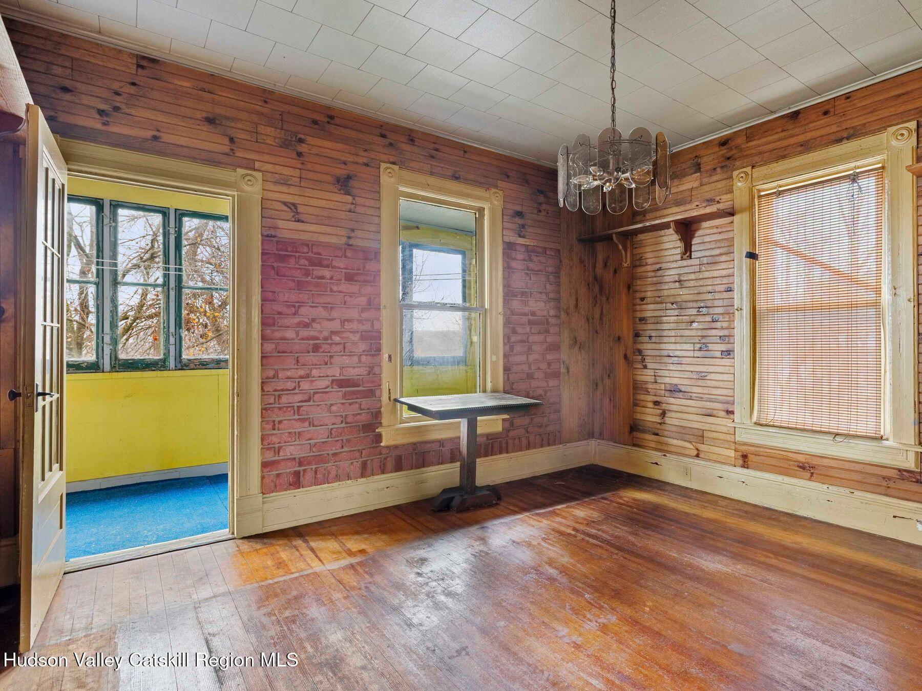 29 New Street Catskill, NY 12414 - Photo 15 of 46 a view of an empty room with a window and wooden floor