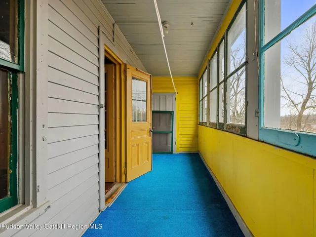 a view of a bathroom with a tub and a window