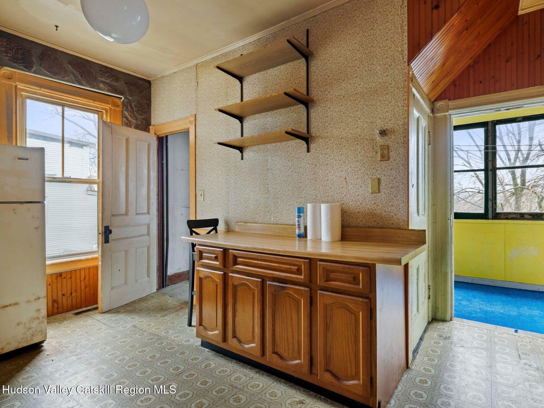 29 New Street Catskill, NY 12414 - Photo 19 of 46 a kitchen with stainless steel appliances granite countertop a sink a stove and a refrigerator