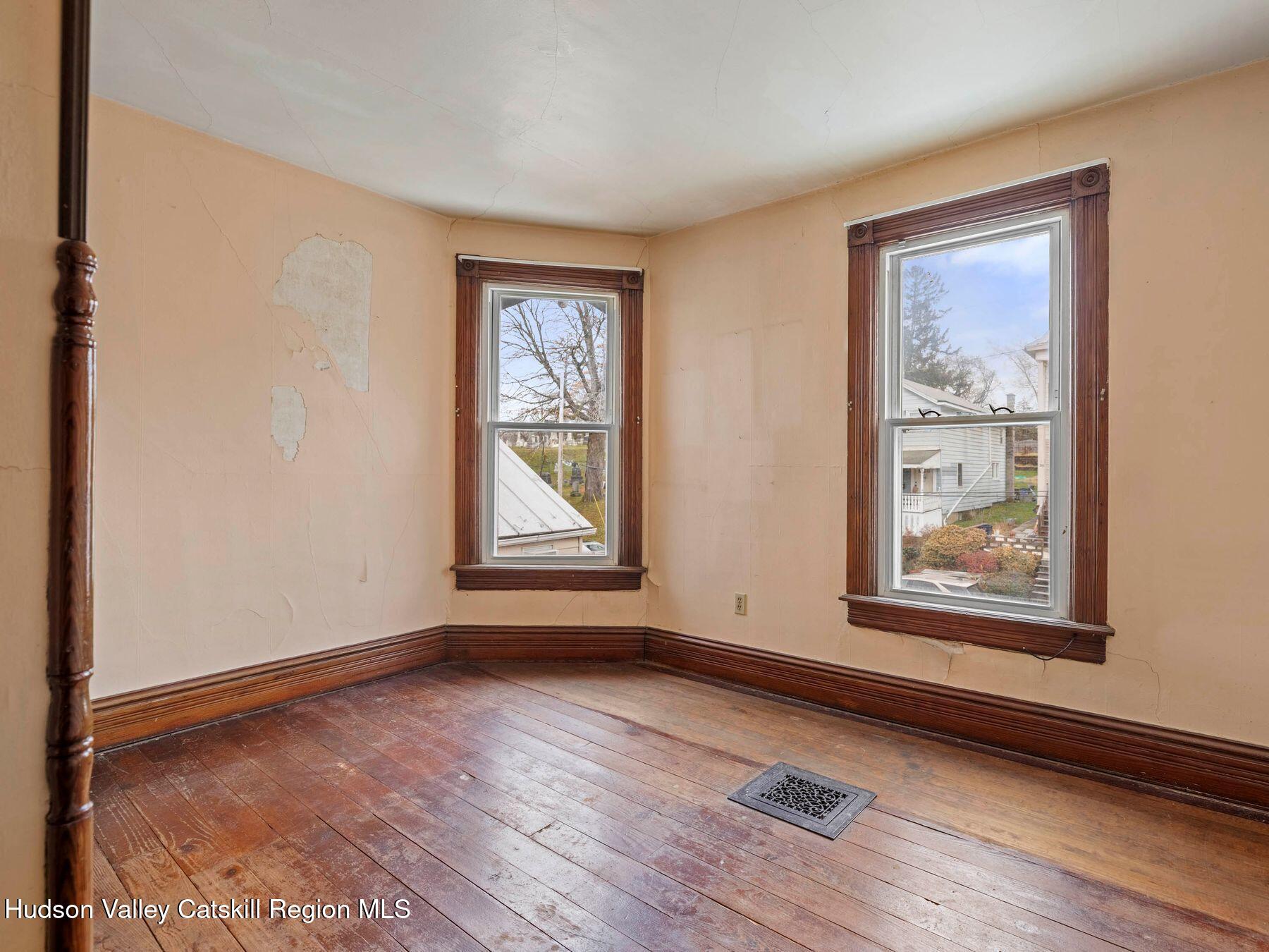 29 New Street Catskill, NY 12414 - Photo 24 of 46 wooden floor in an empty room with a window
