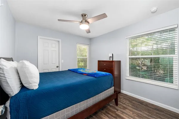 a bedroom with a bed and window