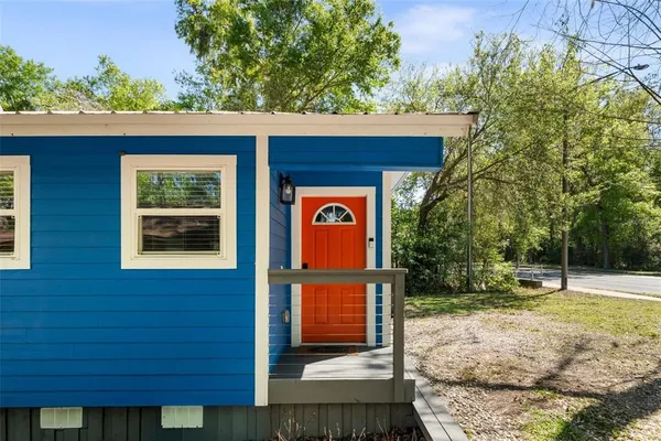 a view of front door and small yard