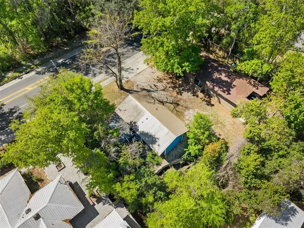 an aerial view of a house with yard