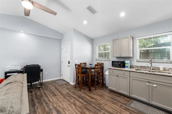 a kitchen with a sink and cabinets