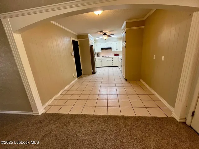 a view of empty room with a fireplace