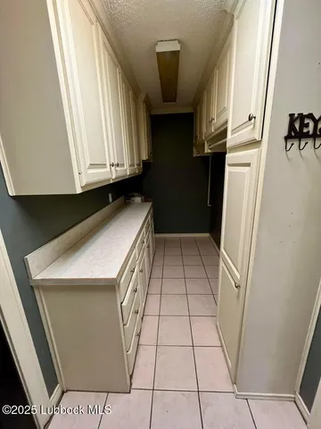 a bedroom with a bed dresser and a window