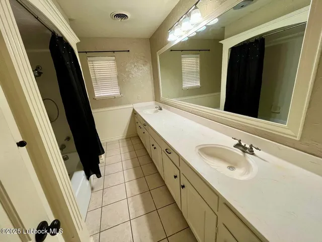 a white toilet sitting next to a sink
