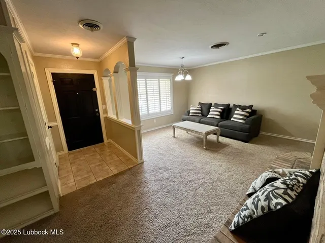 a living room with furniture and a rug