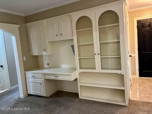a view of cabinets and window in a room