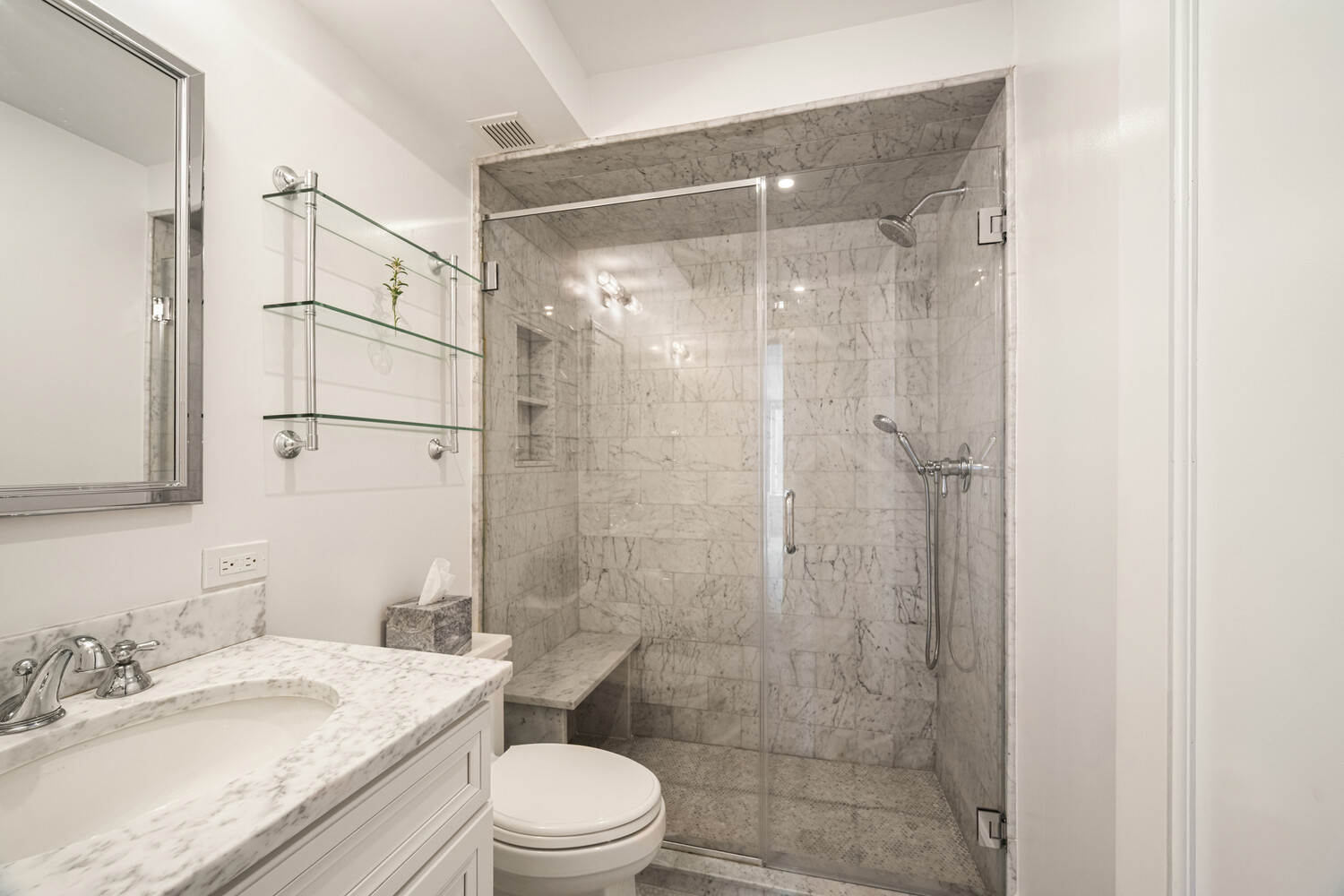 190 East 72nd Street, Unit 14D Manhattan, NY 10021 - Photo 11 of 12 a bathroom with a sink a toilet and shower