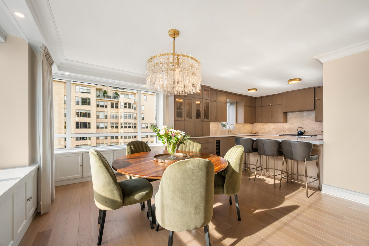 190 East 72nd Street, Unit 14D Manhattan, NY 10021 - Photo 3 of 12 a view of a dining room with furniture a chandelier and wooden floor