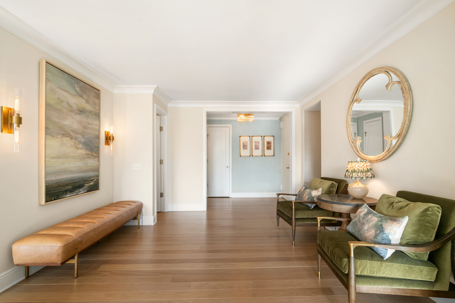 190 East 72nd Street, Unit 14D Manhattan, NY 10021 - Photo 5 of 12 a living room with furniture a mirror and a table