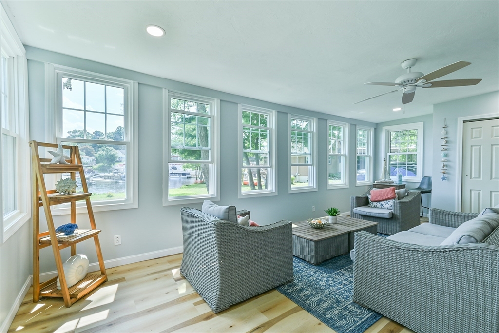 23 Lakeview Road Webster, MA 01570 - Photo 20 of 35 a living room with furniture and floor to ceiling windows