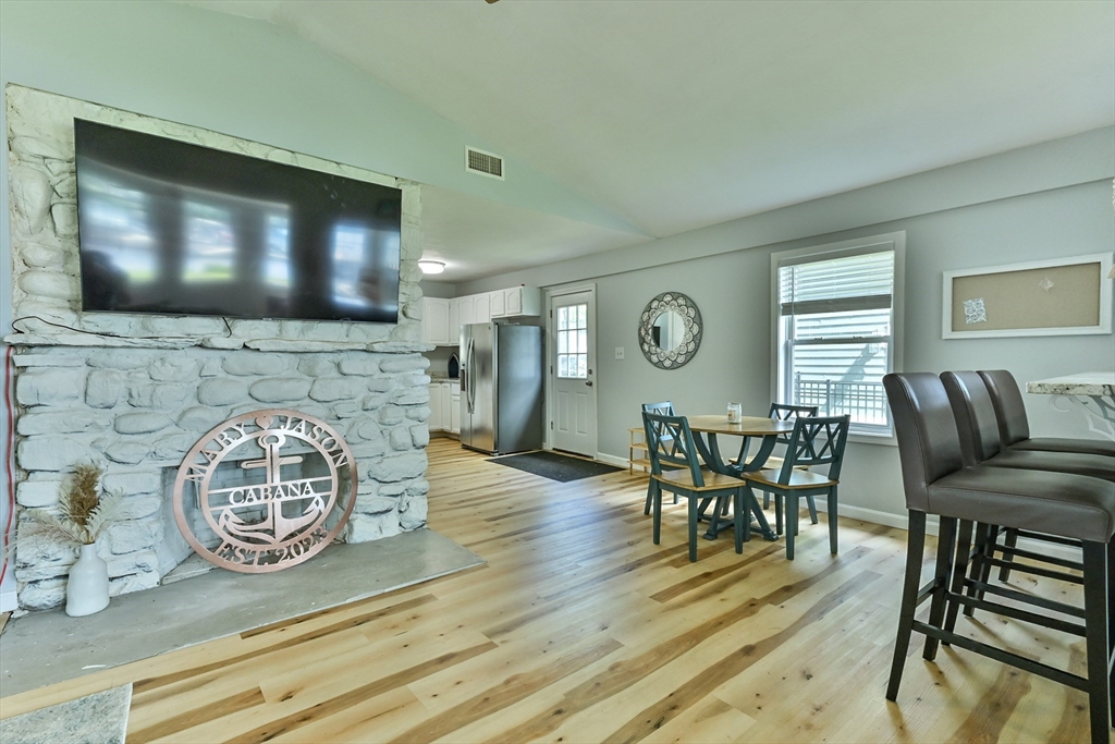 23 Lakeview Road Webster, MA 01570 - Photo 21 of 35 a view of a dining room with furniture and wooden floor
