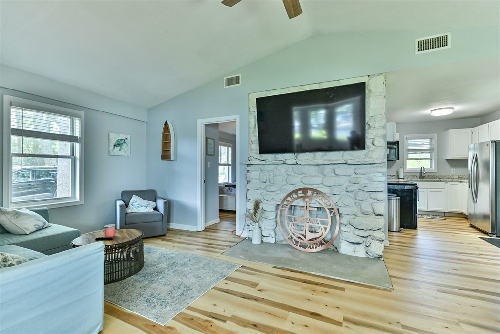 23 Lakeview Road Webster, MA 01570 - Photo 28 of 35 a living room with furniture and a flat screen tv