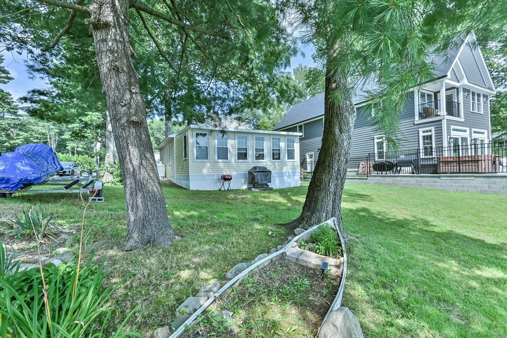 23 Lakeview Road Webster, MA 01570 - Photo 5 of 35 a view of a house with backyard and a tree