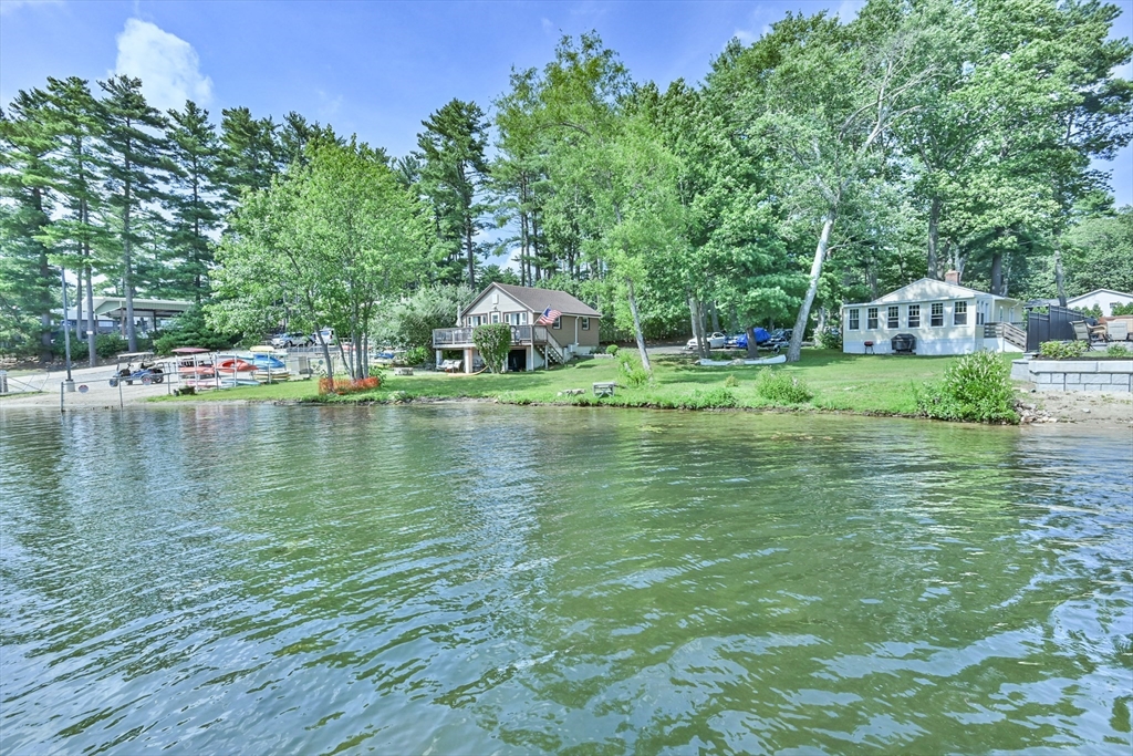23 Lakeview Road Webster, MA 01570 - Photo 6 of 35 a backyard of a house with lots of green space and fountain