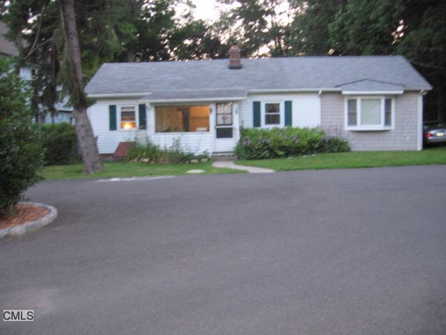 3 Turnabout Lane Darien, CT 06820 - Photo 1 of 1 a view of a house with a yard and large tree
