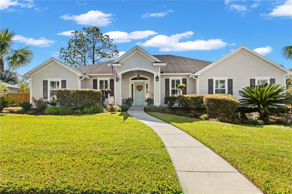 11981 Southwest 1st Road Gainesville, FL 32607 - Photo 1 of 49 a front view of a house with yard and green space