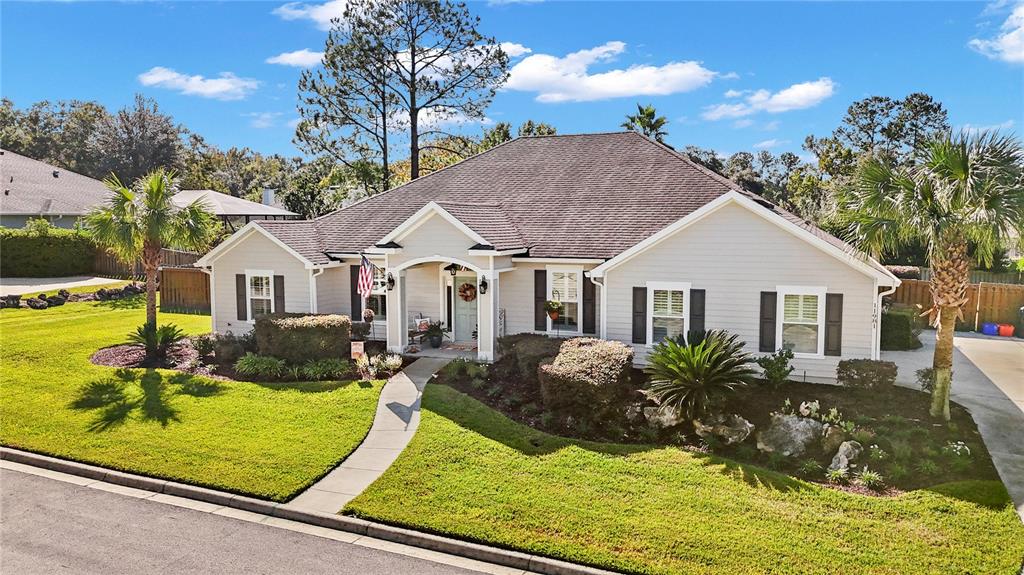 11981 Southwest 1st Road Gainesville, FL 32607 - Photo 2 of 49 a front view of a house with garden