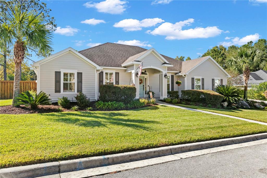 11981 Southwest 1st Road Gainesville, FL 32607 - Photo 3 of 49 a front view of a house with a yard