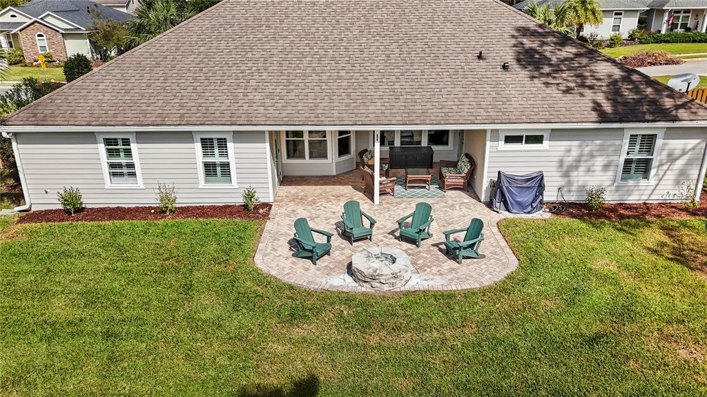 11981 Southwest 1st Road Gainesville, FL 32607 - Photo 41 of 49 a front view of a house with a garden and patio