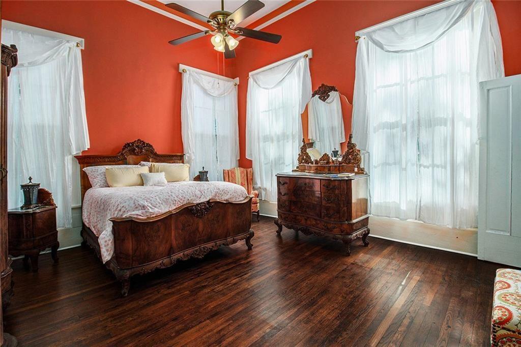 112 Hillcrest Road West Point, GA 31833 - Photo 13 of 34 a bedroom with a bed and wooden floor