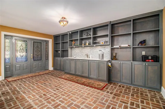 a room with a cabinets and a window