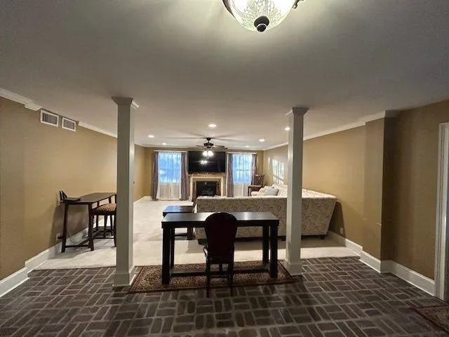a living room with furniture and kitchen view