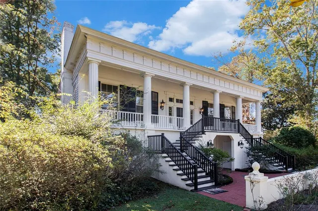 front view of a house with a garden