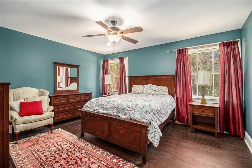 112 Hillcrest Road West Point, GA 31833 - Photo 25 of 34 a bedroom with a bed and a chandelier