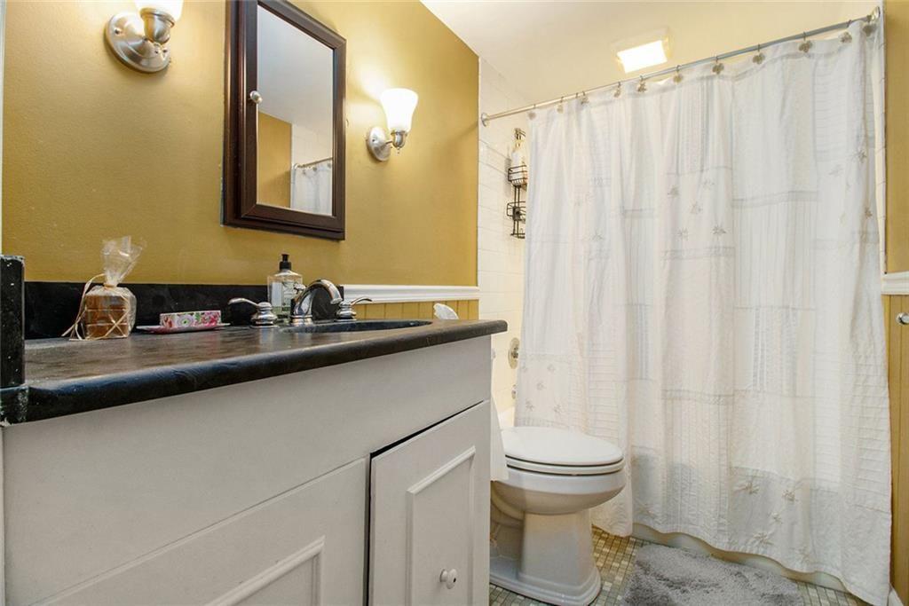 112 Hillcrest Road West Point, GA 31833 - Photo 28 of 34 a bathroom with a sink a toilet and a mirror