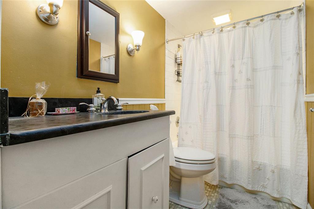 112 Hillcrest Road West Point, GA 31833 - Photo 28 of 34 a bathroom with a sink a toilet and a mirror