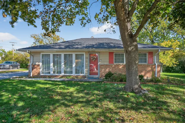 front view of a house with a yard