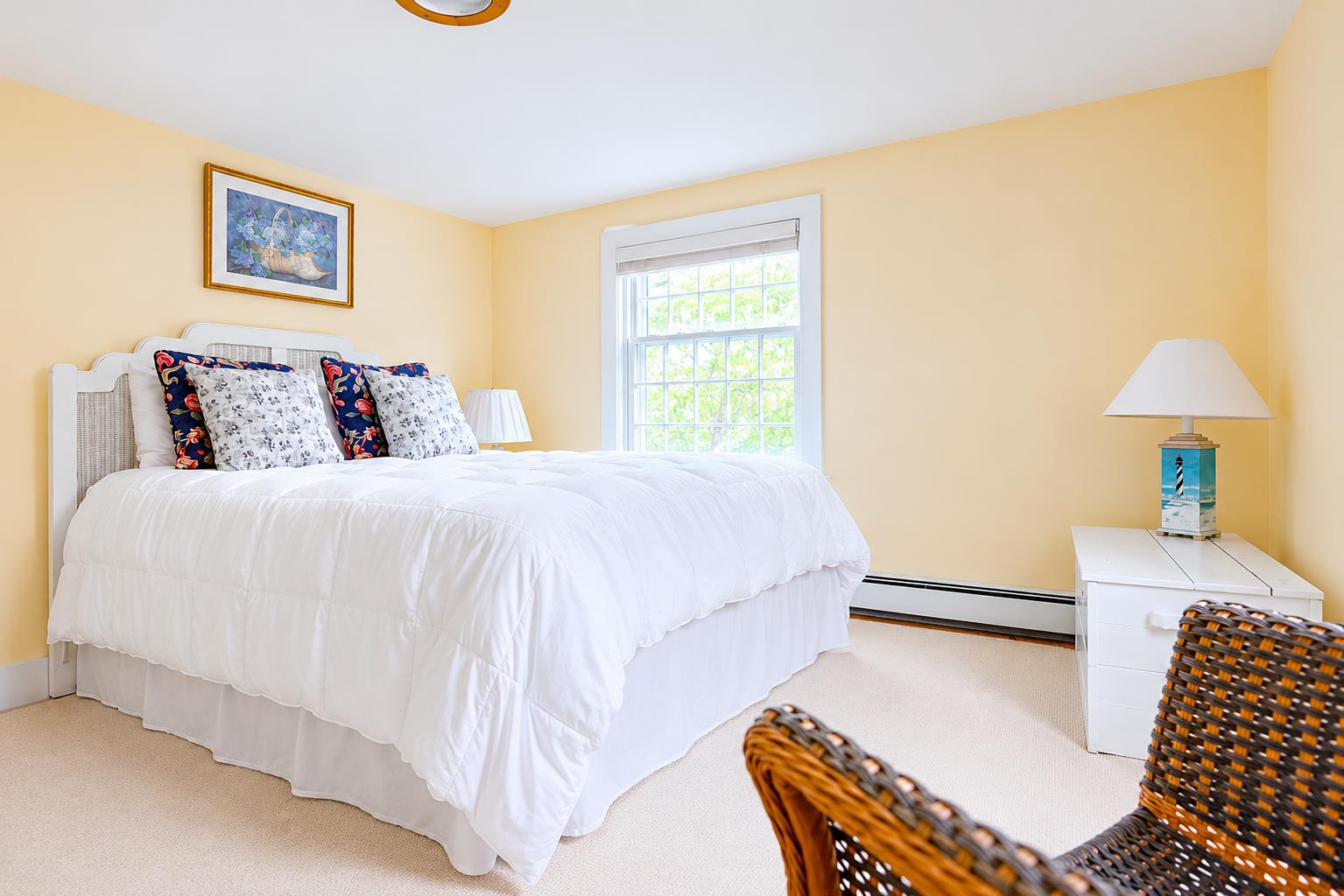 12 King Street Nantucket, MA 02554 - Photo 17 of 32 a bedroom with a bed and a dresser with rug