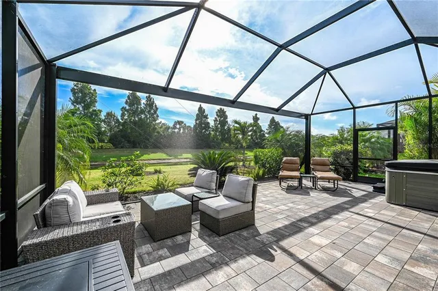 a building outdoor space with patio furniture and potted plants