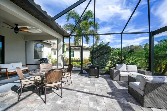 a outdoor space with patio the couches and a dining table with the view