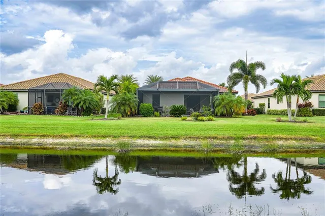 a view of a lake with a house in the background