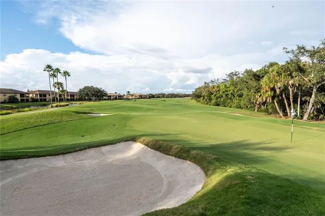 a view of a golf course with a lake