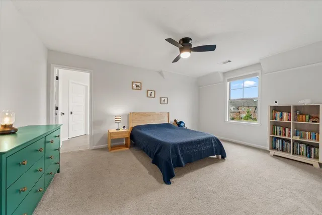 a bathroom with a granite countertop sink a mirror and a bathtub