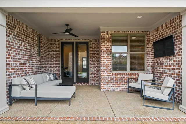 a front view of a house with a large window