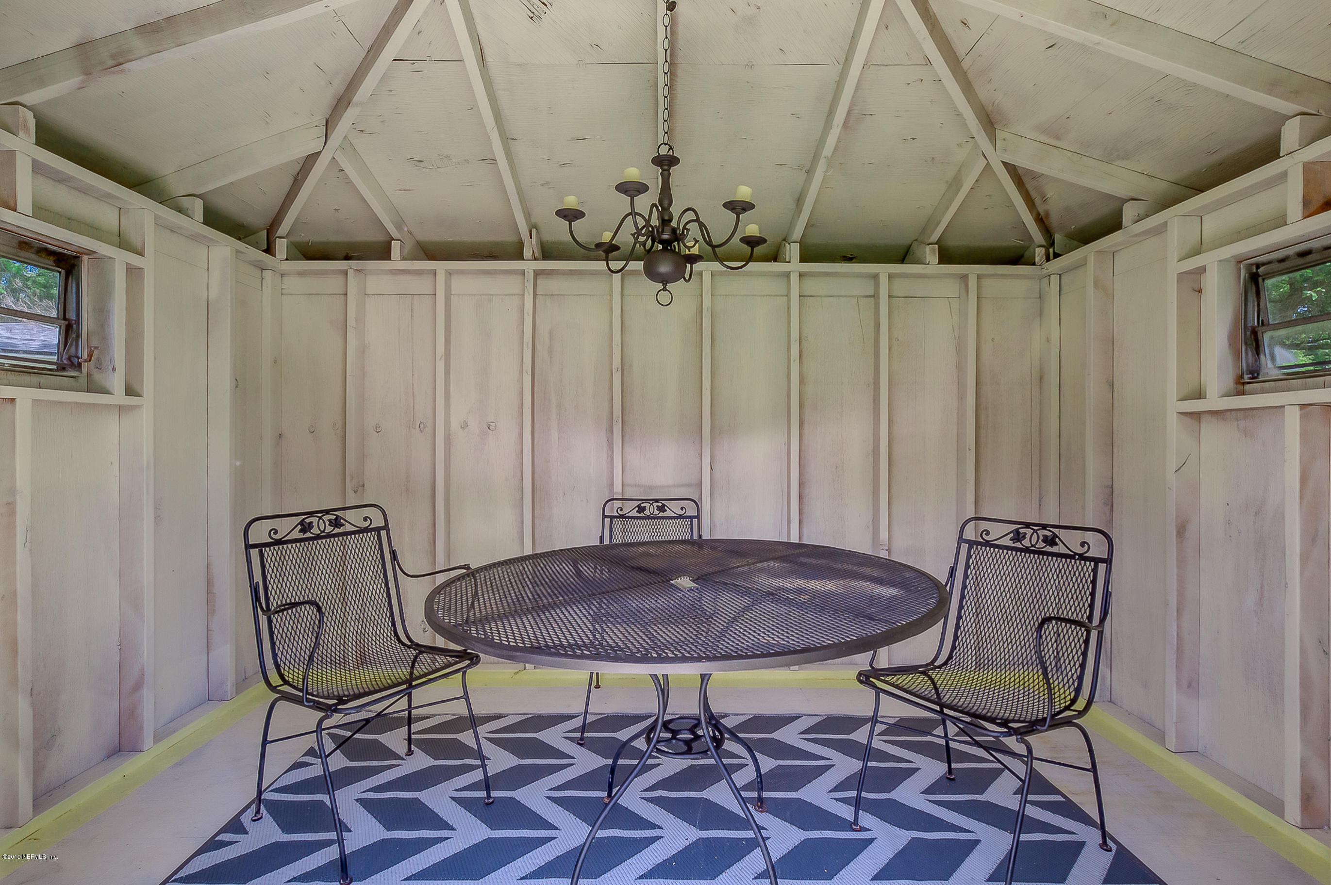 4548 Milstead Road Jacksonville, FL 32210 - Photo 11 of 37 a view of a table and chair in the room