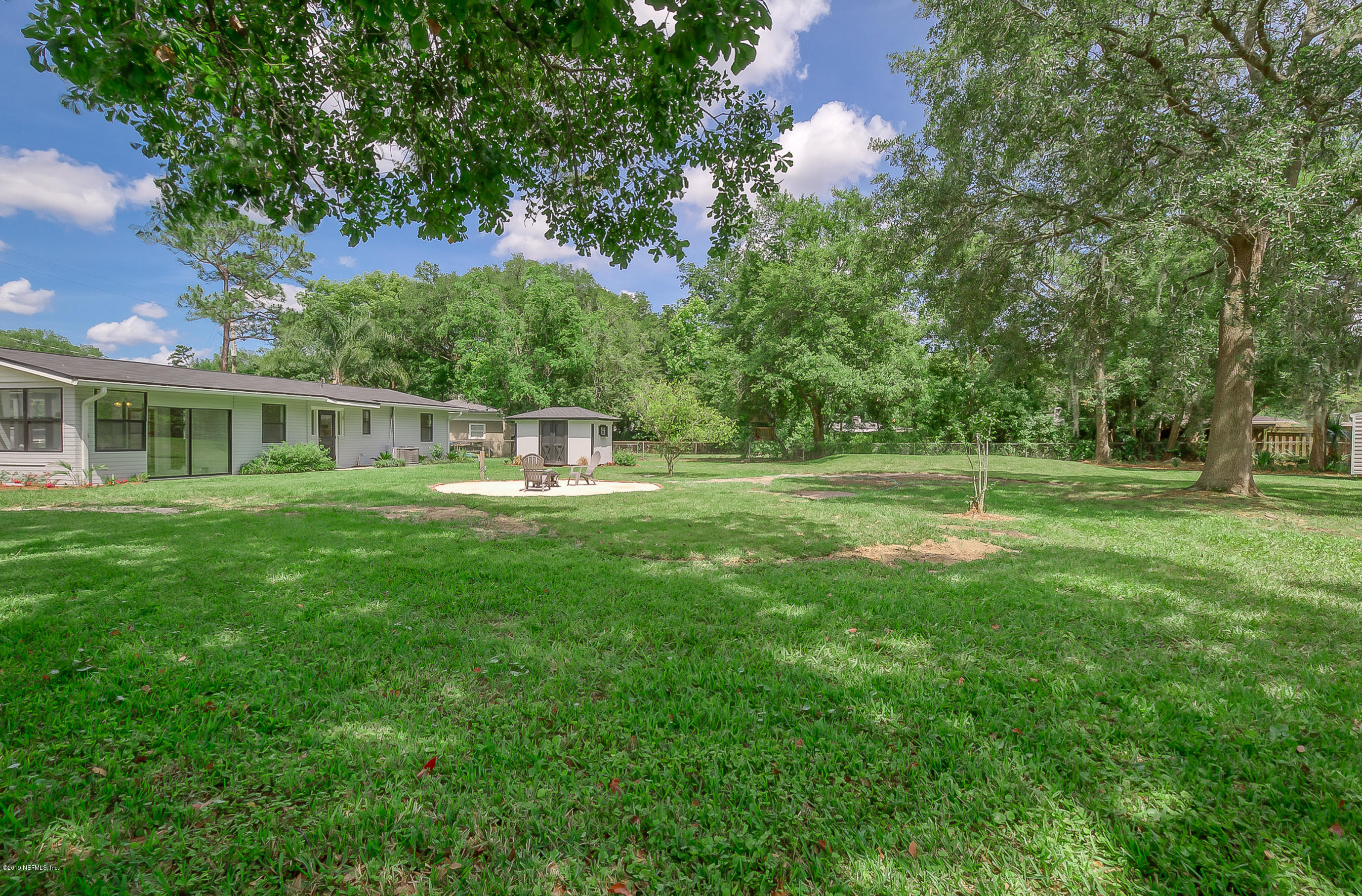 4548 Milstead Road Jacksonville, FL 32210 - Photo 13 of 37 a view of a house with a big yard