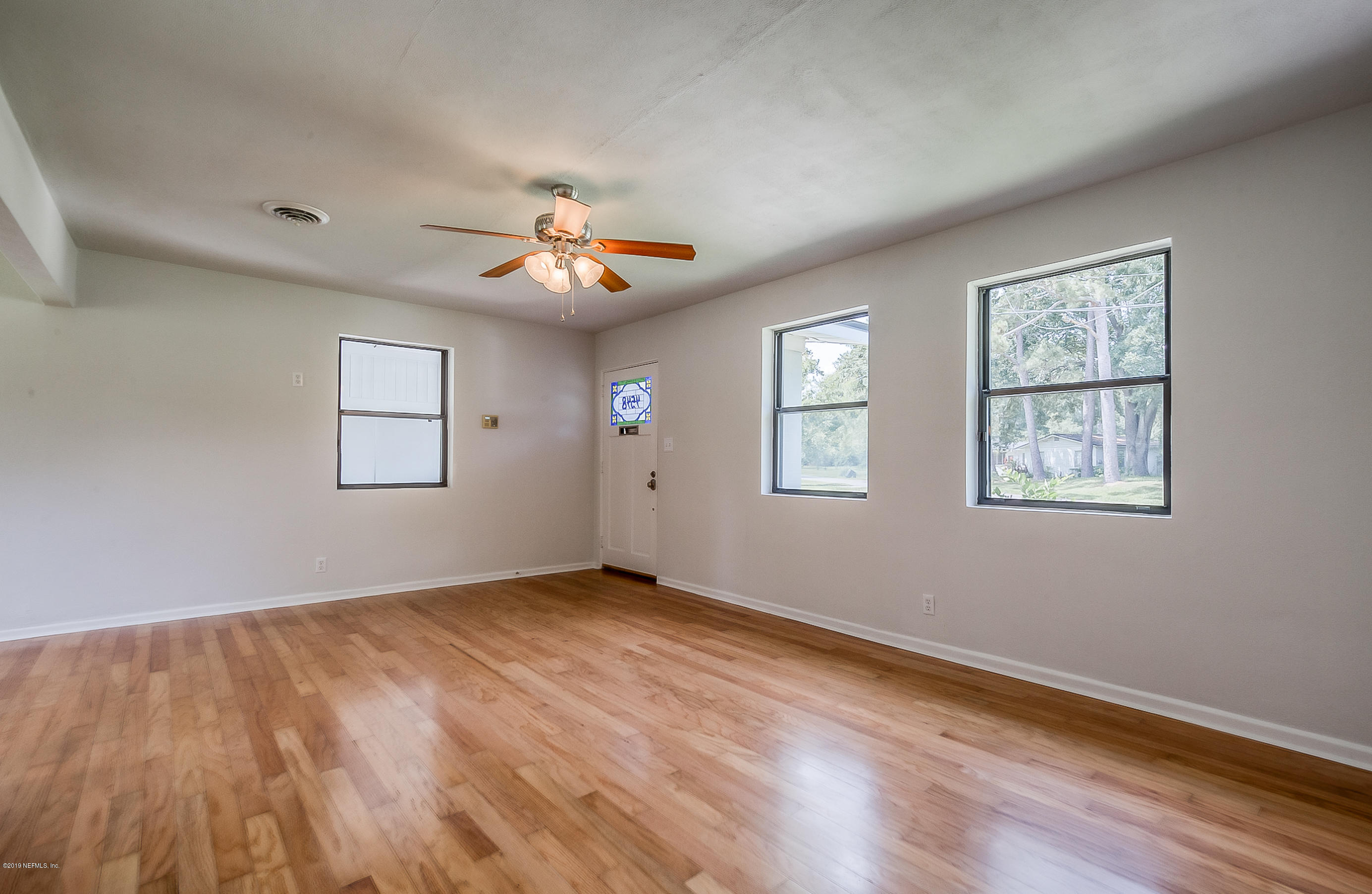 4548 Milstead Road Jacksonville, FL 32210 - Photo 18 of 37 a view of an empty room with a window
