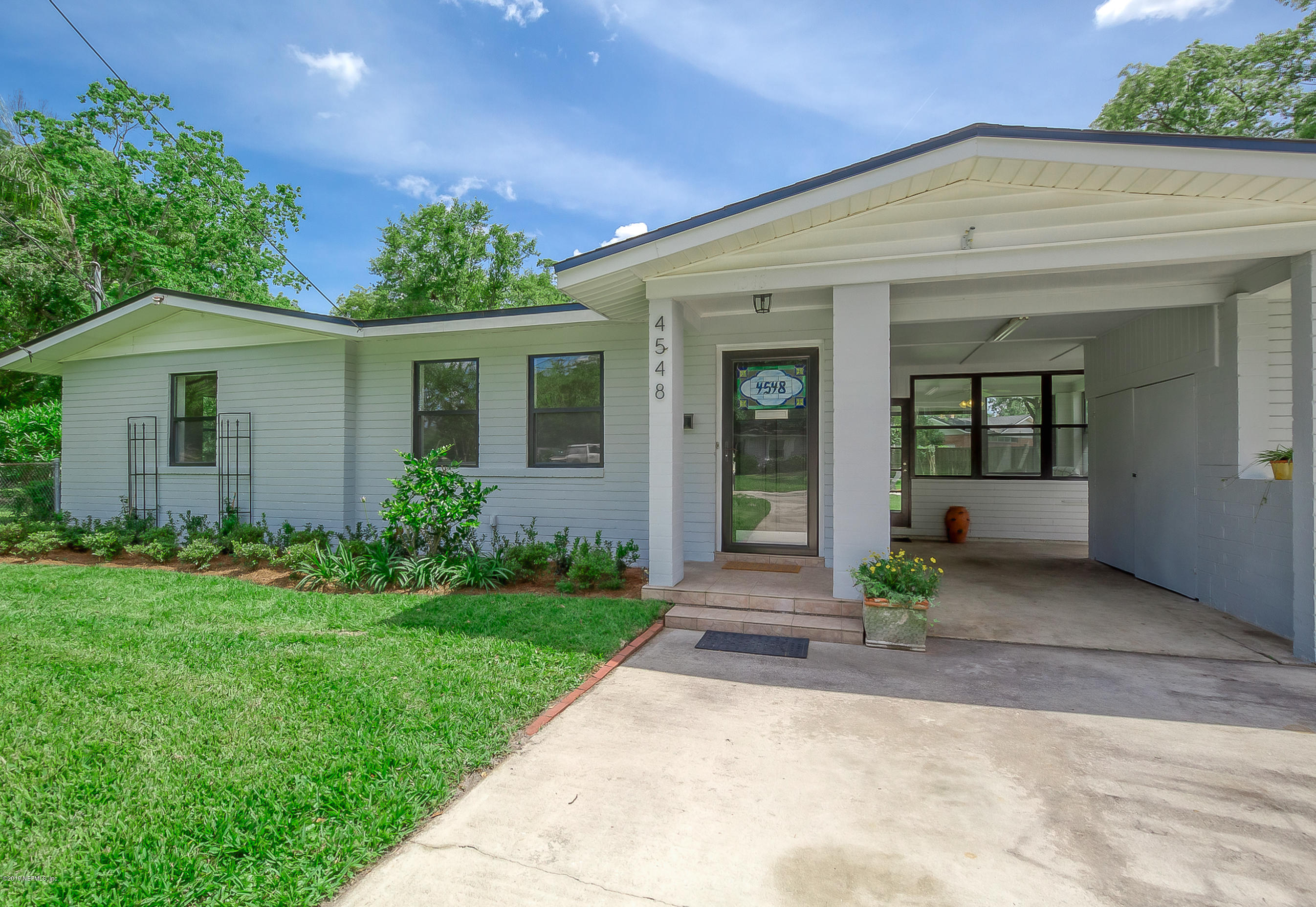 4548 Milstead Road Jacksonville, FL 32210 - Photo 2 of 37 front view of a house with a yard