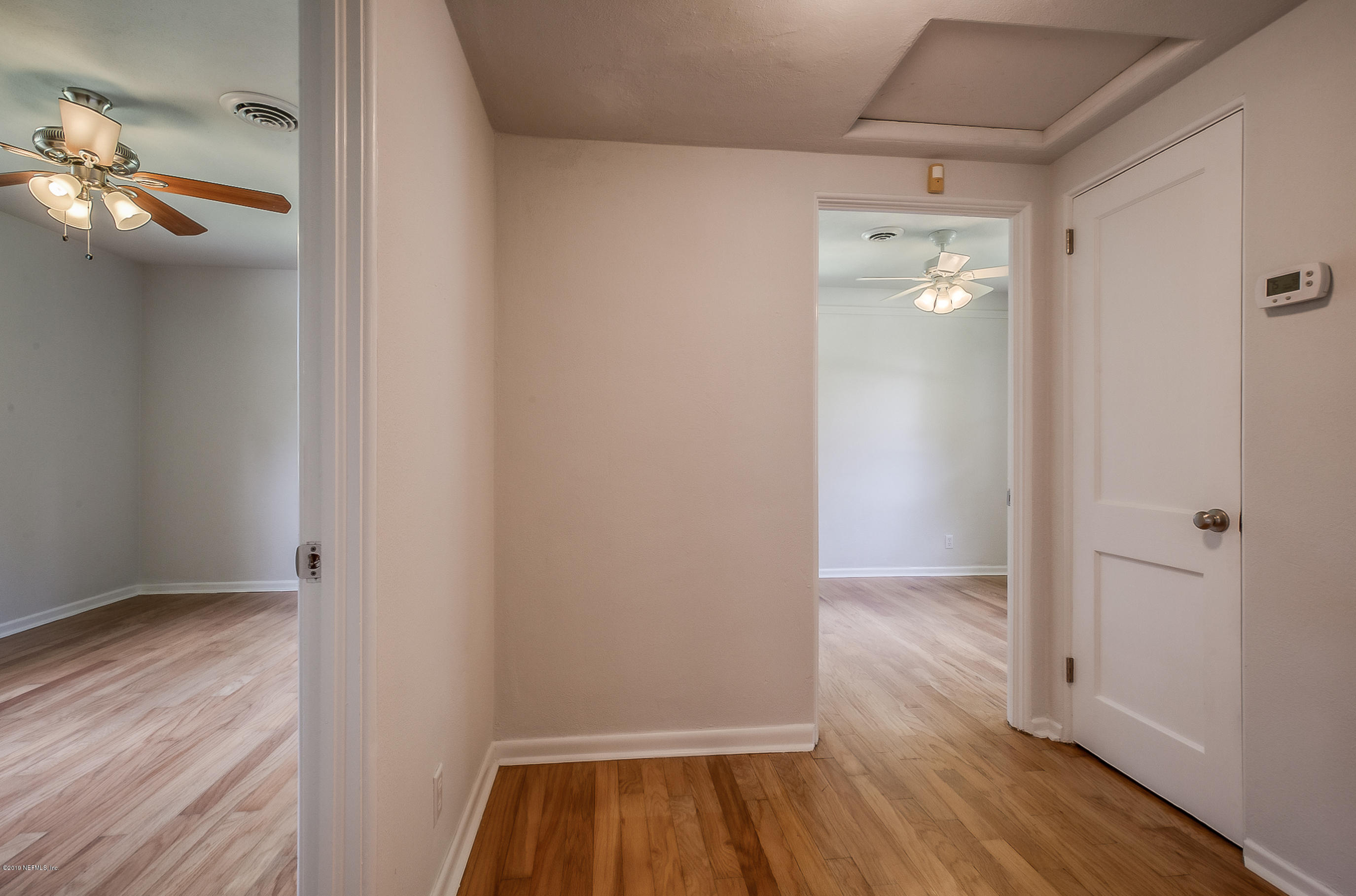 4548 Milstead Road Jacksonville, FL 32210 - Photo 26 of 37 wooden floor in an empty room