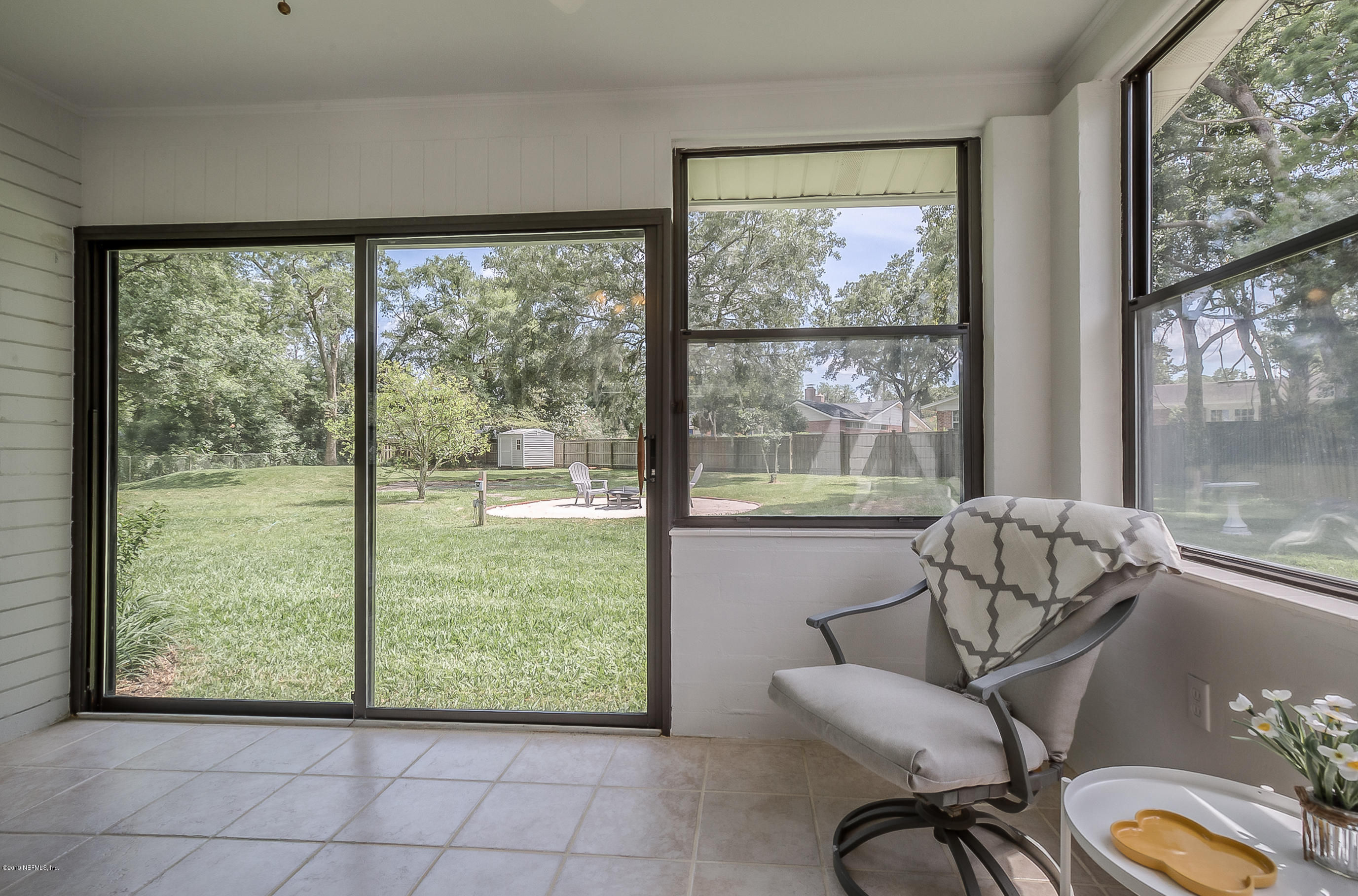 4548 Milstead Road Jacksonville, FL 32210 - Photo 28 of 37 a living room with furniture and a large window