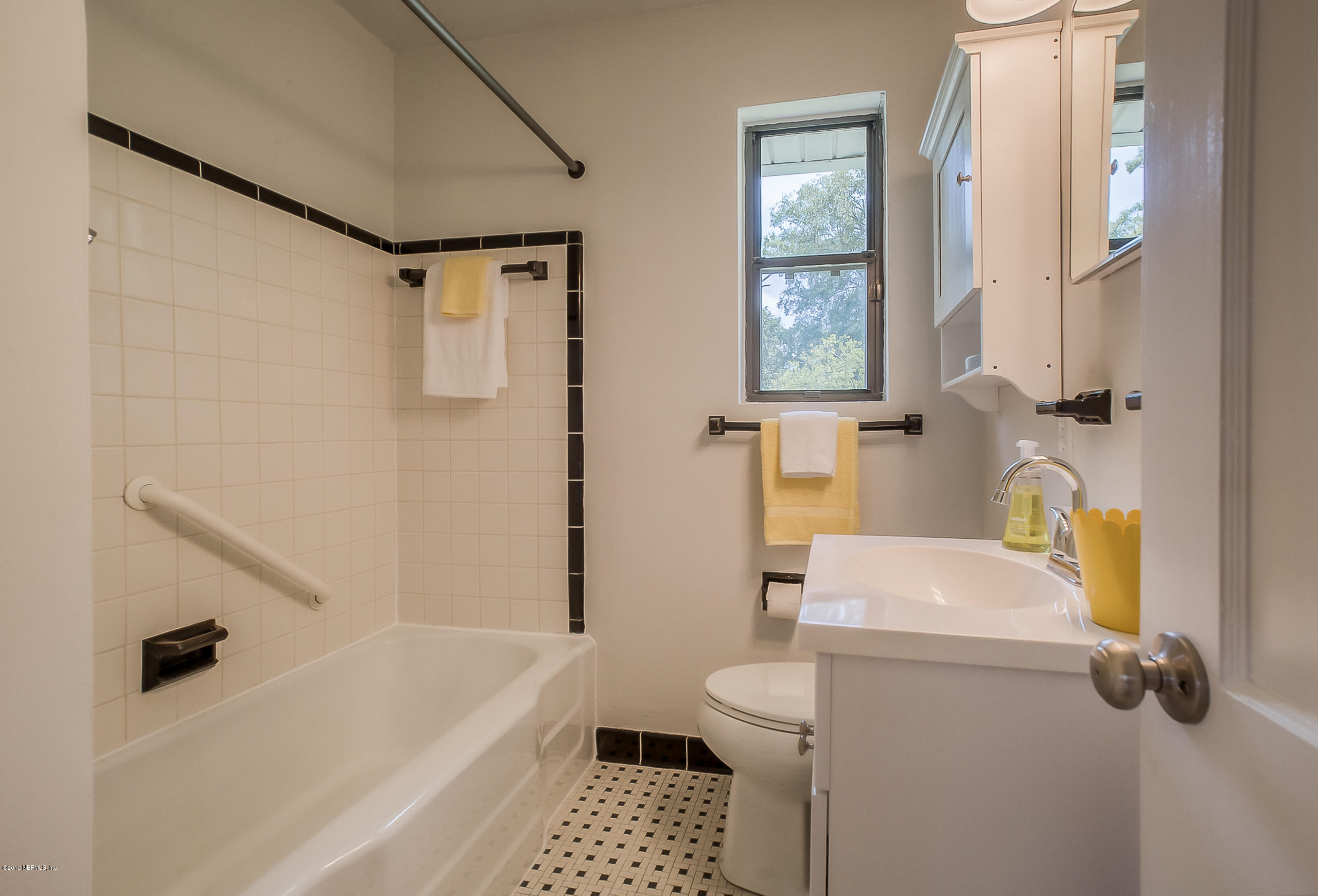 4548 Milstead Road Jacksonville, FL 32210 - Photo 29 of 37 a bathroom with a sink a toilet and a bathtub