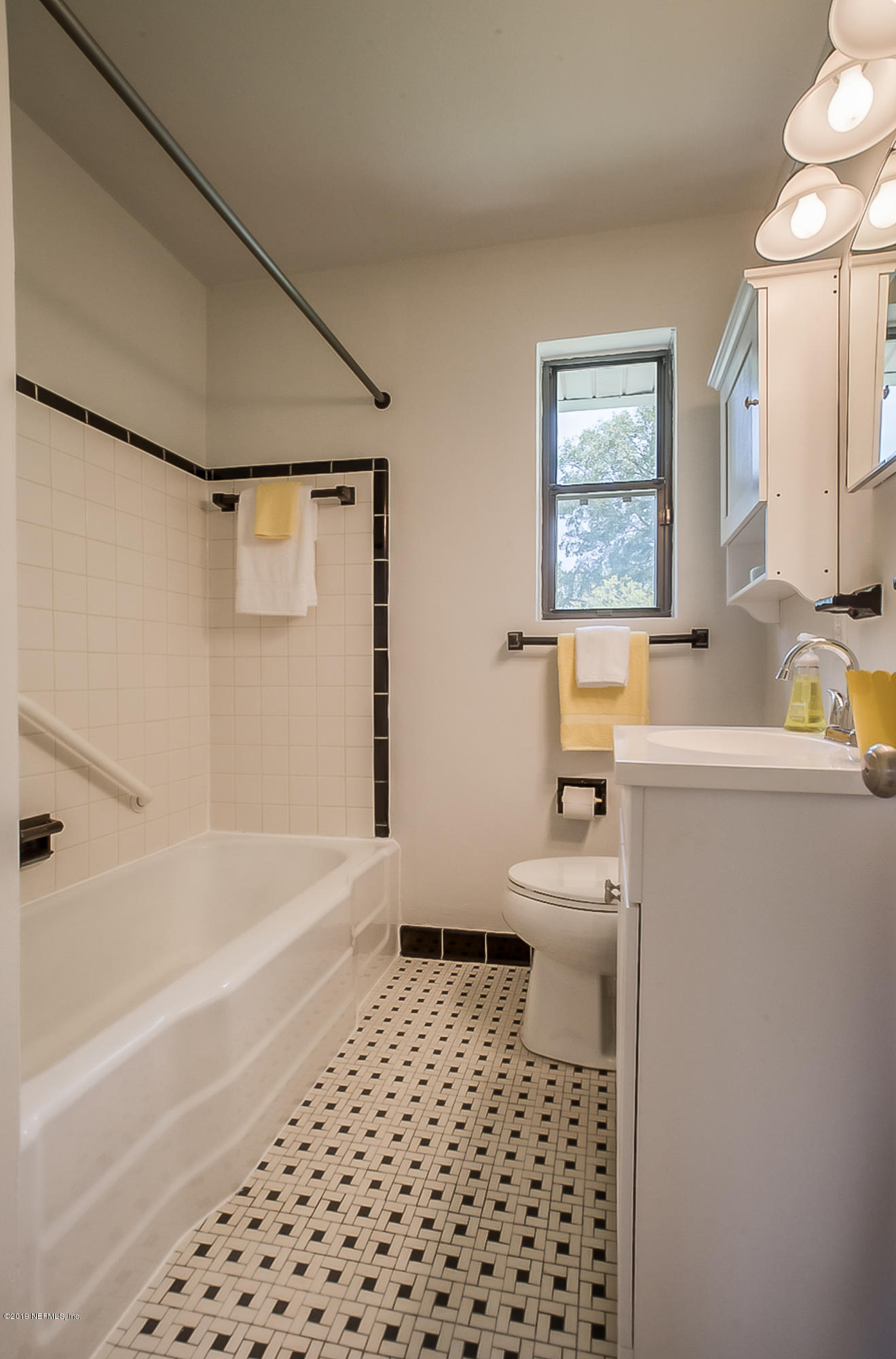 4548 Milstead Road Jacksonville, FL 32210 - Photo 31 of 37 a bathroom with a sink a toilet and shower