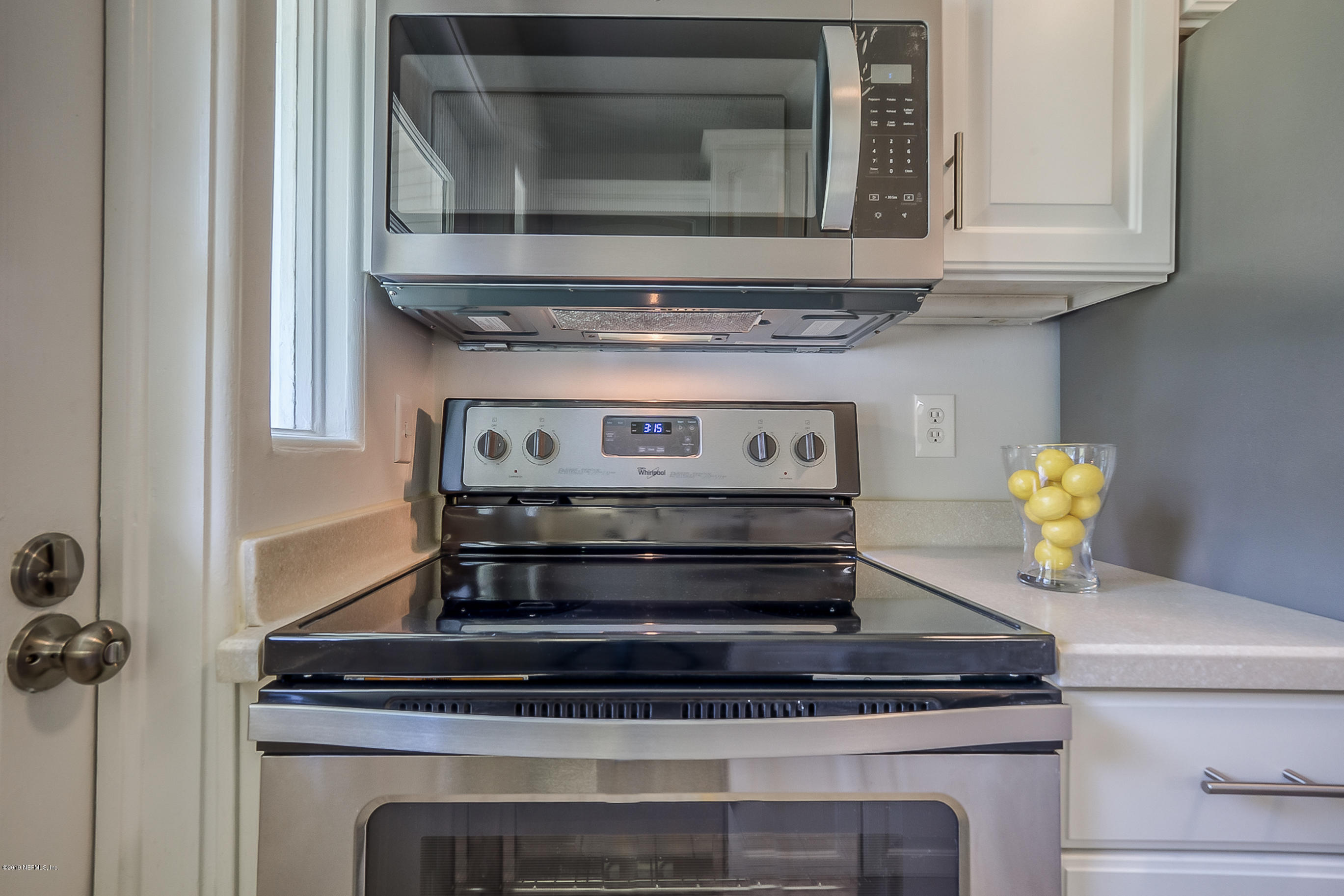 4548 Milstead Road Jacksonville, FL 32210 - Photo 35 of 37 a stove top oven sitting inside of a kitchen